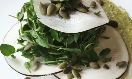 Black radish arugula salad with pumpkin seed dressing